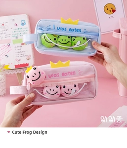 Close-up of cute frog pencil cases in blue and pink with transparent window and plush crown