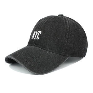 Washed black denim baseball cap with white NYC embroidery and classic curved brim