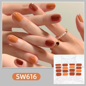 Detail of gradient brown and orange waterproof nail stickers with model hand display