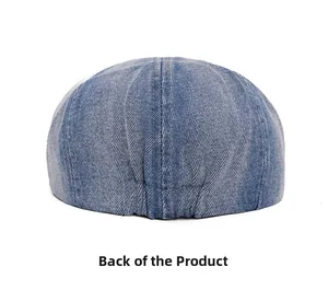 Detailed back view of washed denim newsboy cap showing the elastic adjustable strap