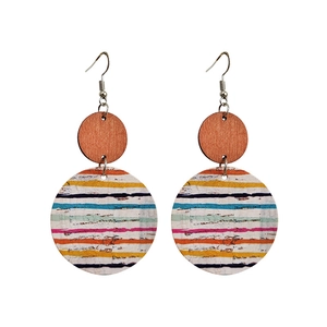 Artistic bohemian drop earrings with wood circles and colorful striped cork patterns
