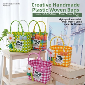 Detail of colorful hand-woven plastic picnic bags with floral and bow decorations