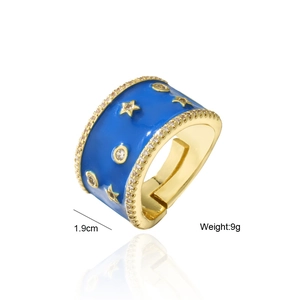 Detail of blue enamel star ring with gold plating, cubic zirconia accents and 1.9cm size
