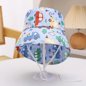 Detail of children's blue sun hat featuring cartoon car prints and adjustable wind cord