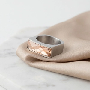 Detail of a rectangular champagne crystal set on a wide silver stainless steel ring