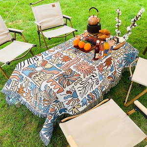 Close-up of Bohemian knit picnic blanket featuring fringe edges and Sun Shine pattern
