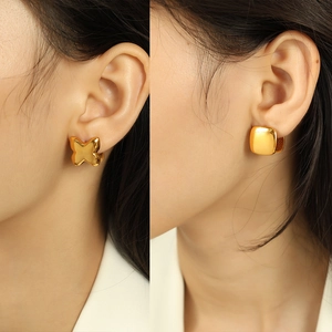 Minimalist 18K gold plated butterfly and square stud earrings shown on a model