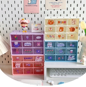 Detail of cute desktop organizer showing four colors and various colorful small drawers