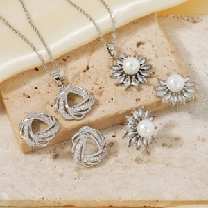 Luxury French style jewelry set with crystal necklace and pearl earrings on silk