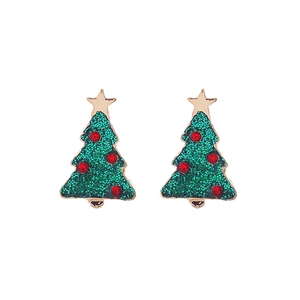 Macro detail of Christmas tree earrings with green glitter and red rhinestones