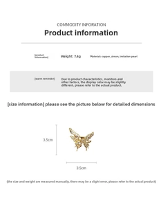 Detailed view of butterfly ring with gold plating, sparkling zircons, and pearls
