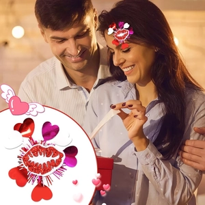 Detailed close-up of heart and lip sequin hair clips with angelic wing decorations