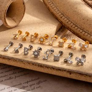 Variety of G23 titanium labret studs with zircon butterflies and geometric shapes