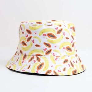 White bucket hat featuring vintage tropical fruit prints with banana and papaya patterns