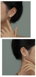 On-ear view of round s925 silver stud earrings with sparkling cubic zirconia stones