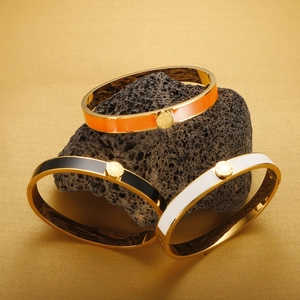 Luxury set of three Roman numeral bangles in orange black and white enamel with gold finish