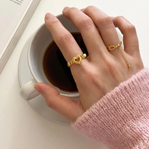 S925 sterling silver gold heart chain ring and beaded ball ring set on a hand