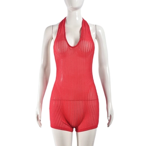Detailed view of red hollow knit halter neck romper with breathable texture