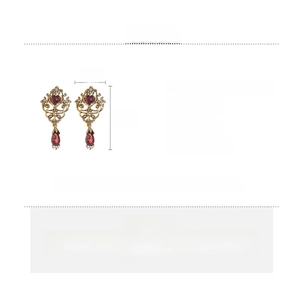 Detailed view of vintage heart earrings with ruby red stones and gold frame dimensions