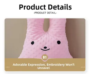 Detail of soft pink minky dot fabric with durable embroidered cartoon smiling rabbit face