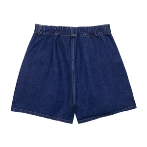 Flat lay of blue denim shorts featuring an elastic waistband and contrasting stitching details