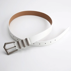 Close-up of a white leather belt with antique bronze geometric buckle and three metal loops