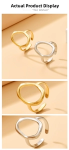 Detail view of gold and silver cutout geometric oval open rings with matte finish