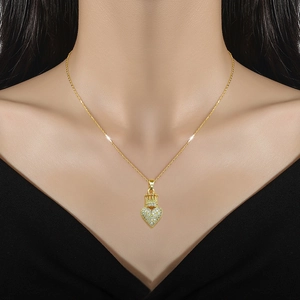 Elegant gold crown heart necklace featuring sparkling full-pave cubic zirconia crystals