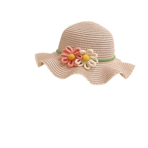 Sweet straw sun hat for girls with 3D floral accents and wavy brim for summer sun protection