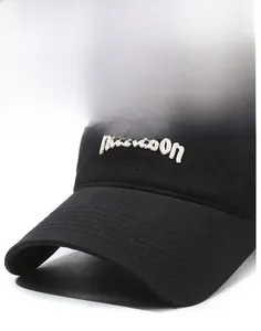 Detailed close-up of white 3D parason embroidery on a black cotton baseball cap brim