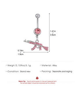 Detail showing dimensions of pink heart and rifle belly ring pendant in 3.6cm x 1.9cm