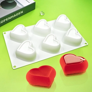 Detail of 6-cavity white heart silicone mold for mousse cakes and chocolate desserts