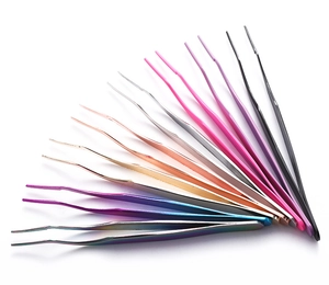 Detailed arrangement of 13 colorful stainless steel precision tweezers on white background