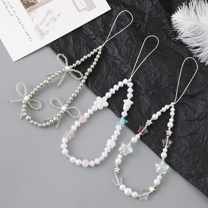 Cordons de téléphone à perles tendance avec perles nacrées et nœuds papillon