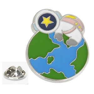 Close-up of astronaut enamel pin with butterfly clutch back on white background