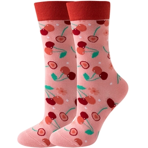 Pink mid-calf socks with red cherry pattern and ribbed cuffs on white background