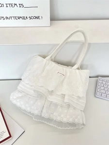 Borsa tote bianca in pizzo a strati con ricami floreali e bordi a volant eleganti