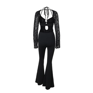 Front detail of long sleeve lace jumpsuit with hollow waist and flared legs in black
