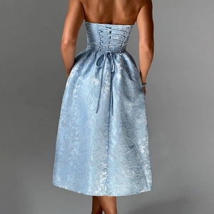 Back view of blue jacquard strapless midi dress with elegant lace-up ribbon closure