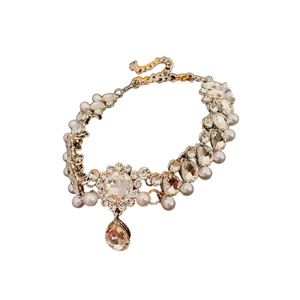 Elegant gold flower necklace with clear rhinestones and a teardrop pearl pendant