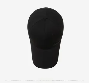 Top down view of black baseball cap with 6-panel structure and embroidered detail