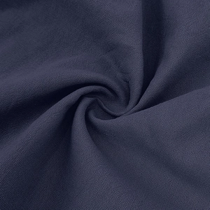 Close-up of navy linen fabric showing premium weave texture and breathable textile details