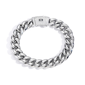 Macro shot of silver stainless steel Cuban link bracelet with iced-out zircon spring clasp