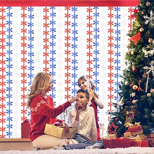 Christmas party backdrop with red and blue snowflake curtains in a cozy family setting