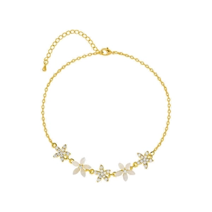 Elegant gold flower bracelet with white enamel and cubic zirconia stones on white background
