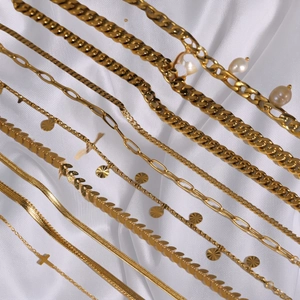 Collection of 18K gold-plated stainless steel anklets with cross pendants and chains
