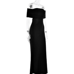 Detailed view of the elegant ruching and textured fabric on this black off-shoulder maxi dress