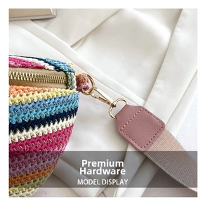 Detailed close-up of bohemian woven bag with brass metal hardware and pink PU leather trim
