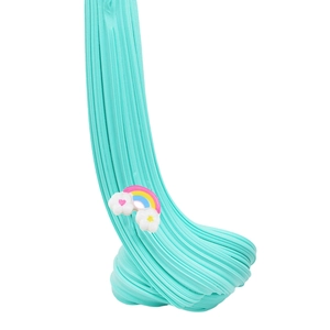 Mint green butter slime being stretched vertically with a cute rainbow cloud charm accessory