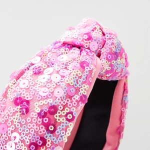 Serre-tête rose à paillettes avec des sequins irisés brillants et un design noué